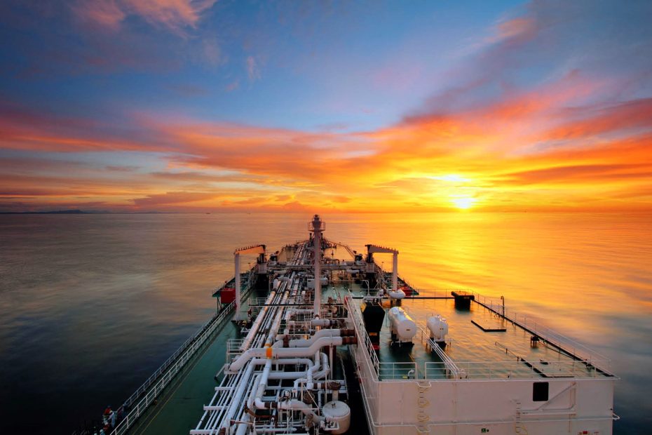 Asia-Europe trade_geo-trends.eu_A container ship sailing under a vibrant sunset, symbolizing the challenges and opportunities in global container shipping, including fleet expansion, capacity reallocation, and trade route adaptations