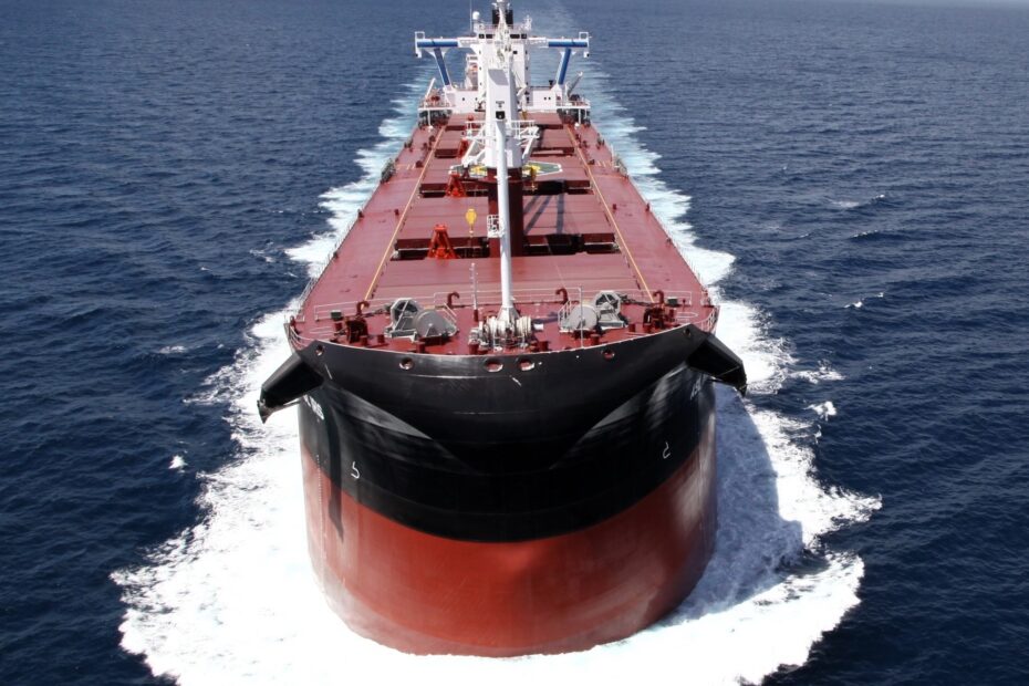 An Ultramax vessel sailing through turbulent waters, symbolizing the volatility and market pressures in the global shipping industry