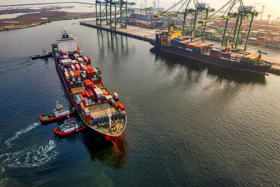 Container ship assisted by tugboats entering port, symbolizing the role of judgment and common sense in shipping
