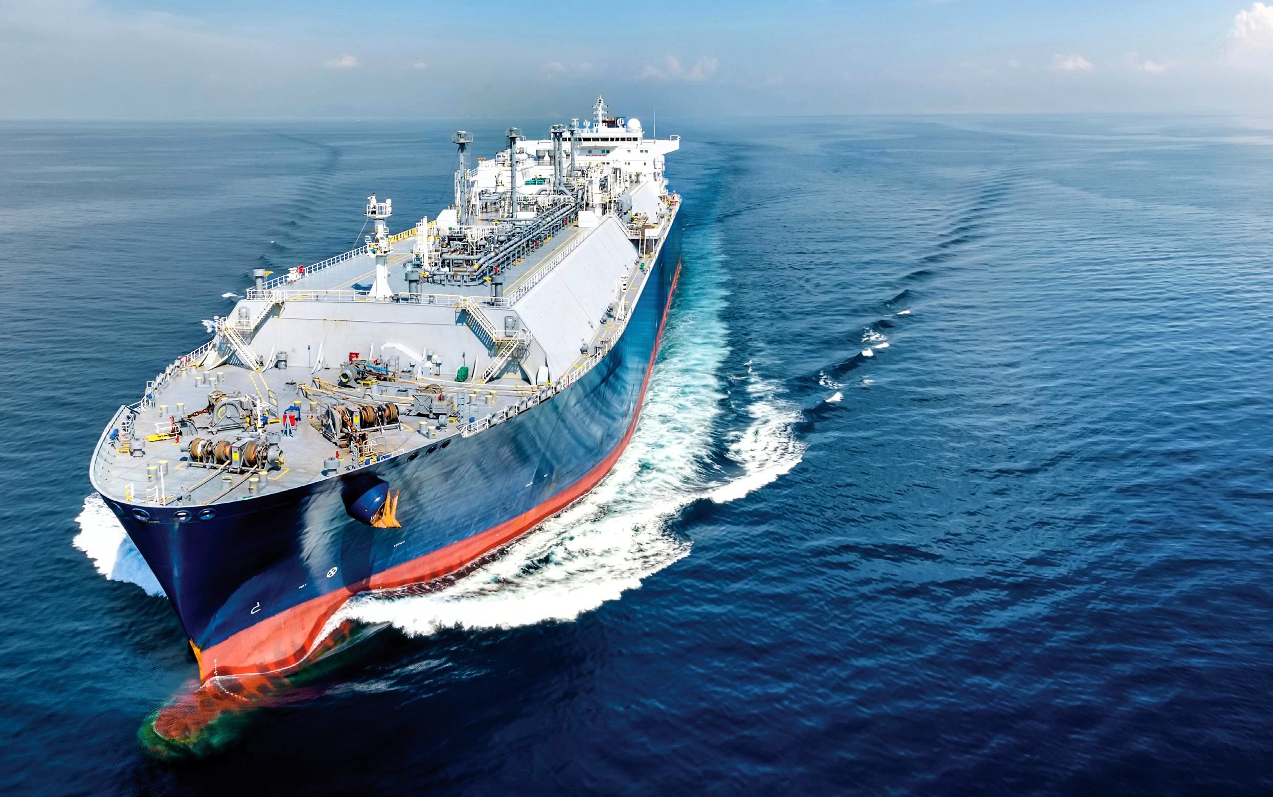A large commercial vessel sailing through calm blue waters, symbolizing progress and resilience in global dry bulk markets