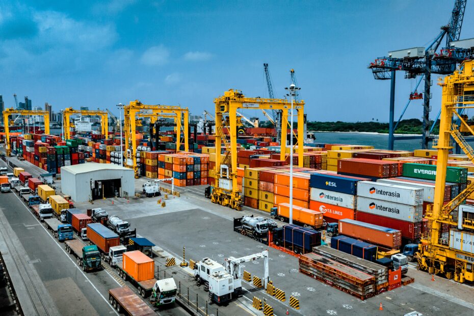 Aerial view of the Port of Dar es Salaam showing container terminals, gantry cranes, cargo vessels, trucks and stacked containers, highlighting Tanzania's expanding logistics infrastructure and its growing role in regional maritime trade