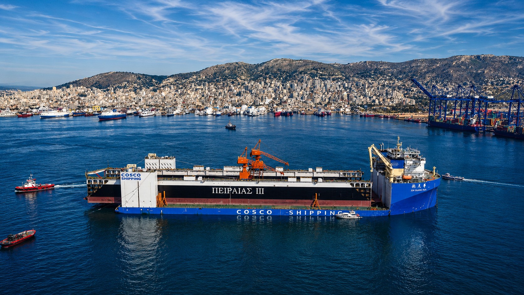 Panoramic view of Piraeus Port with a COSCO SHIPPING vessel in the foreground, container cranes, harbor infrastructure, and cityscape behind