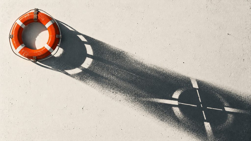 Orange lifebuoy casting a long shadow that gradually transforms into a fragmented targeting reticle on an off-white surface